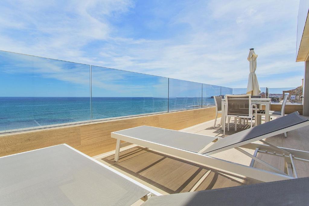 a balcony with a view of the ocean at 129 Luxury Relax La Mata-Alicante Holiday in La Mata
