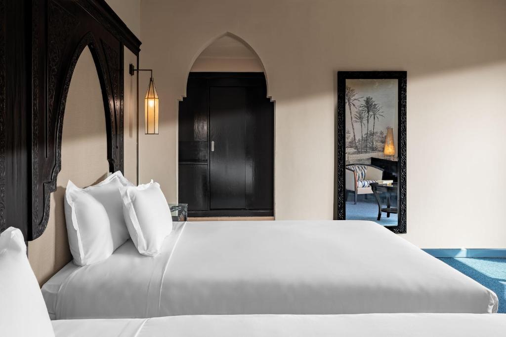 Postel nebo postele na pokoji v ubytování Grand Plaza Marrakech