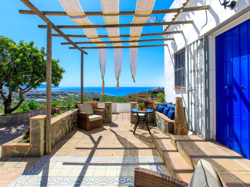 a patio with a view of the ocean at Holiday Home Camelia Blanca by Interhome in Torrox
