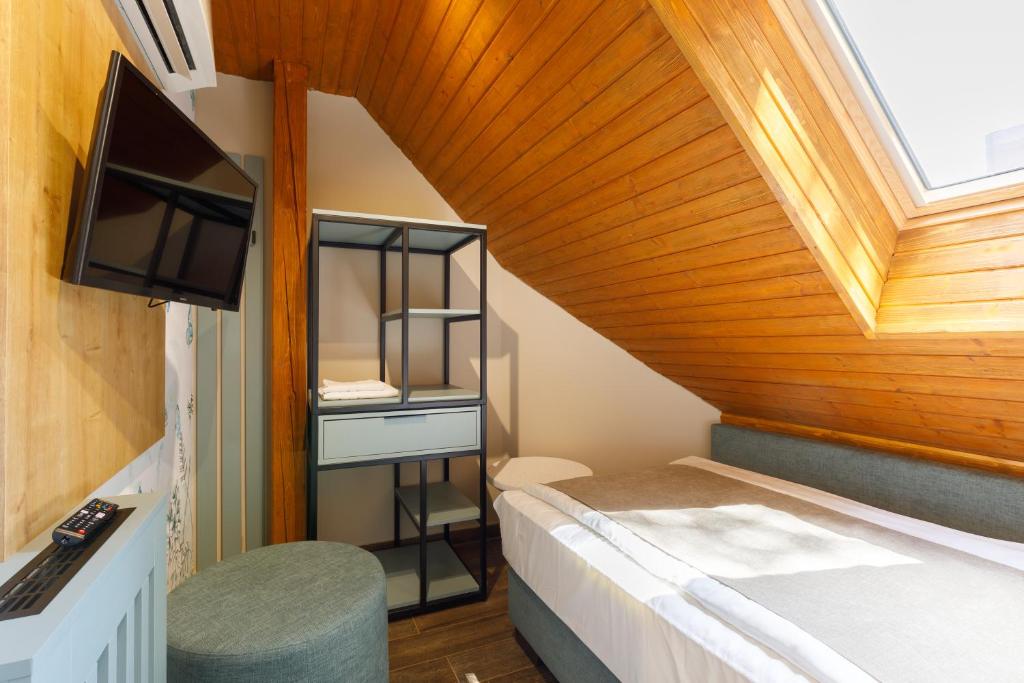Postel nebo postele na pokoji v ubytování Lepke Apartmanház és Étterem