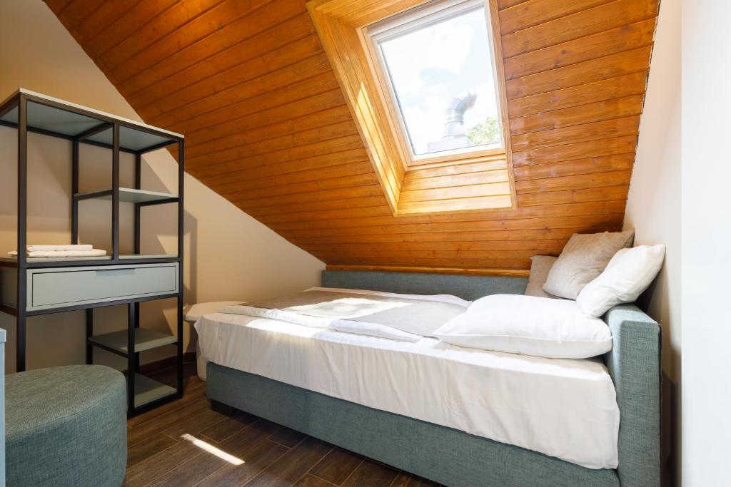 Postel nebo postele na pokoji v ubytování Lepke Apartmanház és Étterem