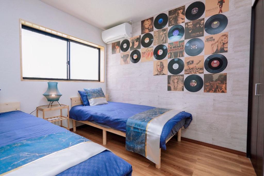 Postel nebo postele na pokoji v ubytování Tsubaki椿