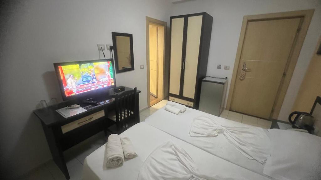 Postel nebo postele na pokoji v ubytování Sunrise Hotel Cameria