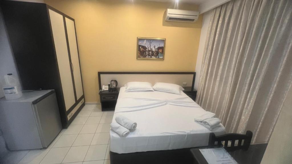 Postel nebo postele na pokoji v ubytování Sunrise Hotel Cameria
