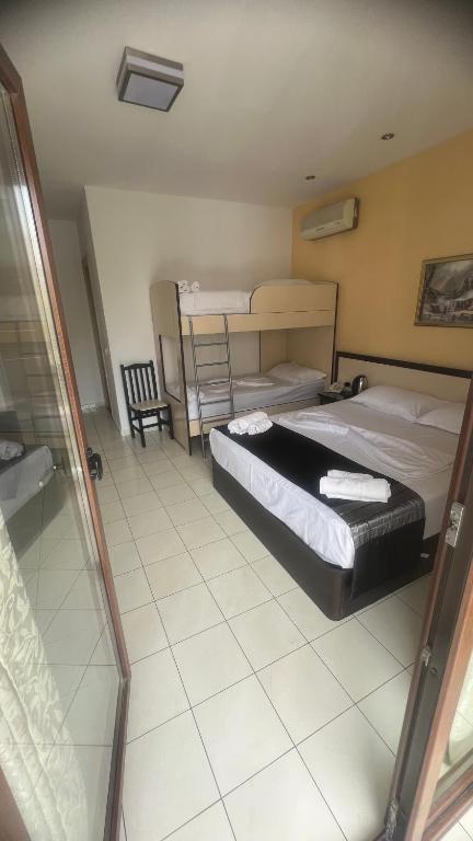 Postel nebo postele na pokoji v ubytování Sunrise Hotel Cameria