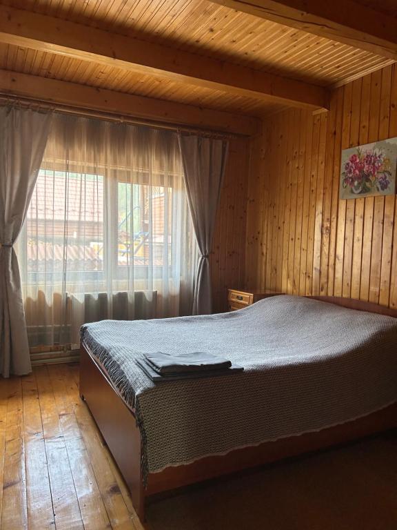 Postel nebo postele na pokoji v ubytování Guest House Kaspiy