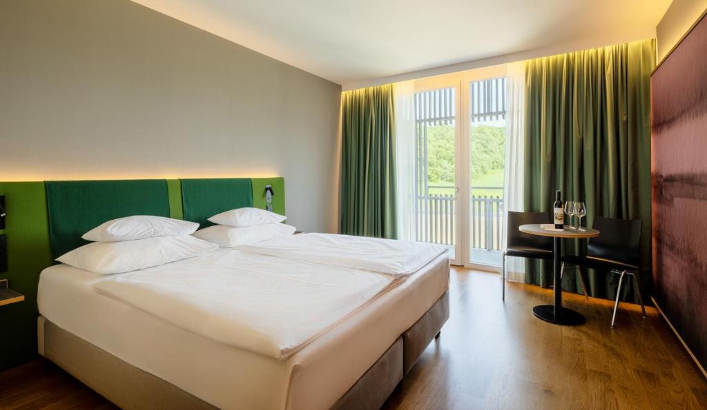 Posteľ alebo postele v izbe v ubytovaní LOISIUM Wine & Spa Hotel Südsteiermark