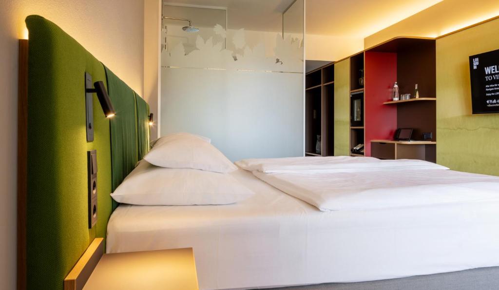 Posteľ alebo postele v izbe v ubytovaní LOISIUM Wine & Spa Hotel Südsteiermark