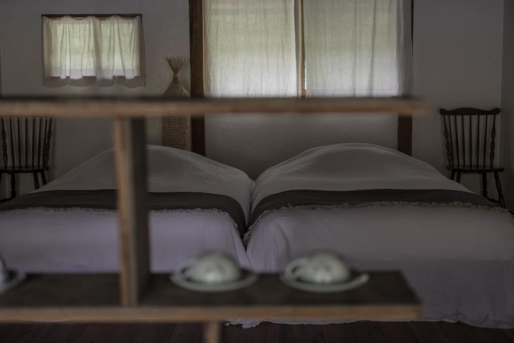 Postel nebo postele na pokoji v ubytování ruisseau