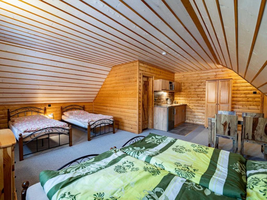 Postel nebo postele na pokoji v ubytování Holiday Home Chalupa U Bobra-1 by Interhome