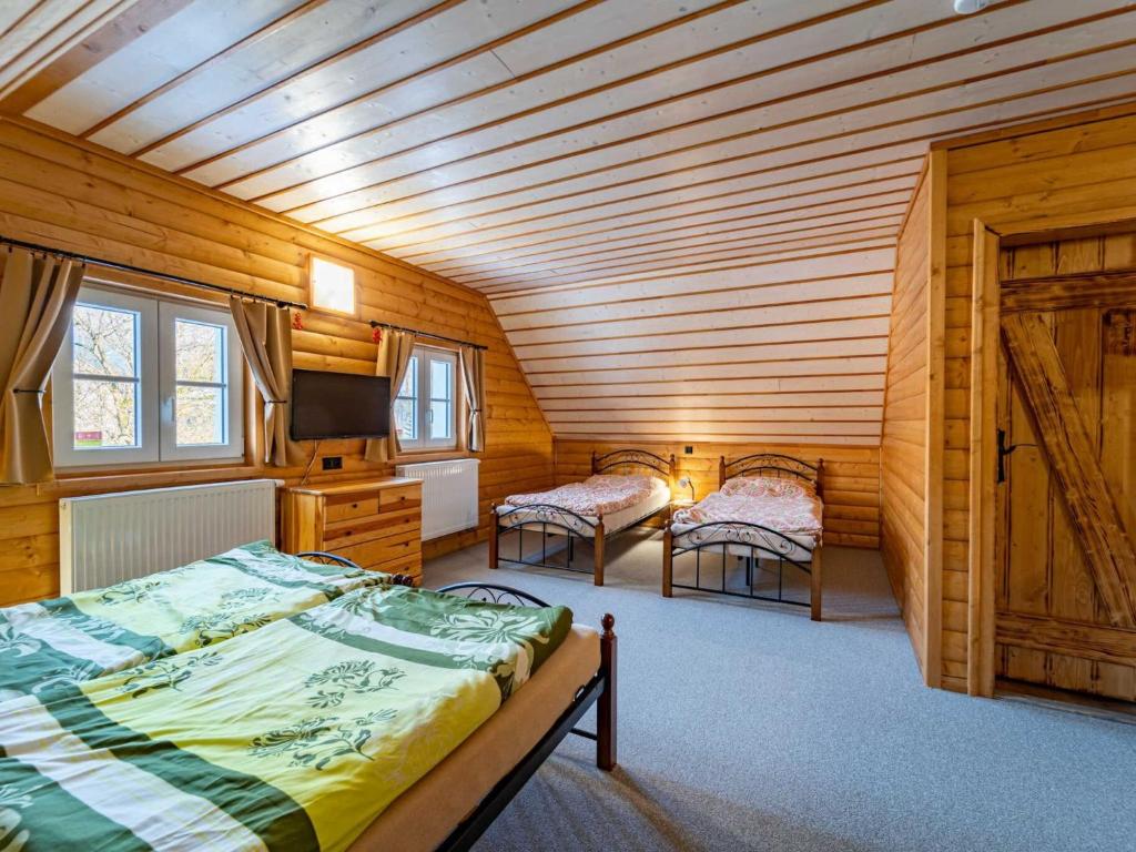 Postel nebo postele na pokoji v ubytování Holiday Home Chalupa U Bobra-1 by Interhome