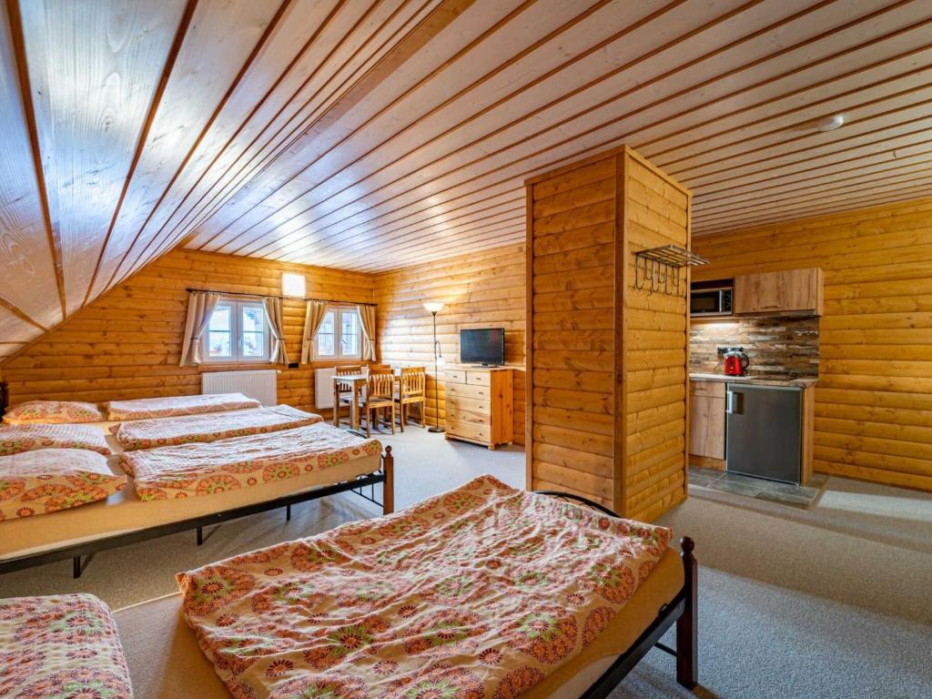 Postel nebo postele na pokoji v ubytování Holiday Home Chalupa U Bobra-1 by Interhome