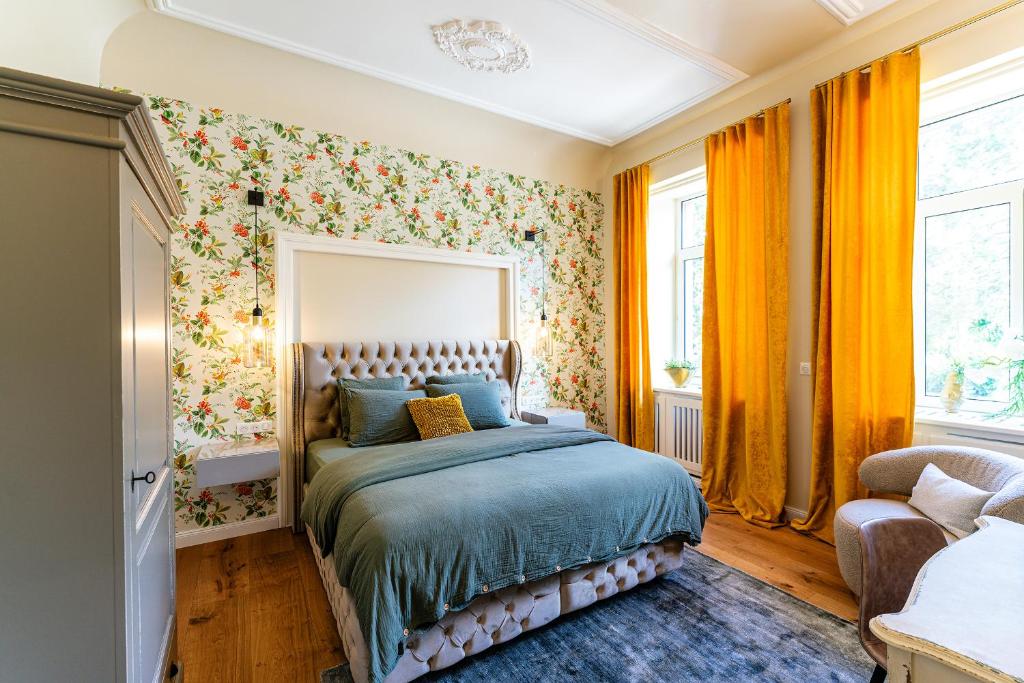 Postel nebo postele na pokoji v ubytování Villa Magnolia Wissembourg