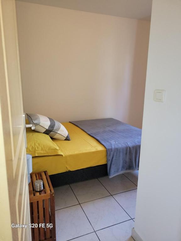Postel nebo postele na pokoji v ubytování Côte ouest - Appartement F3