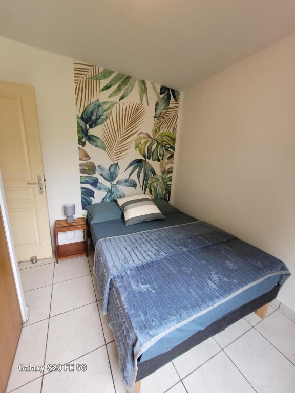 Postel nebo postele na pokoji v ubytování Côte ouest - Appartement F3