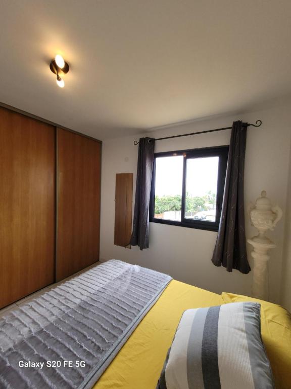 Postel nebo postele na pokoji v ubytování Côte ouest - Appartement F3