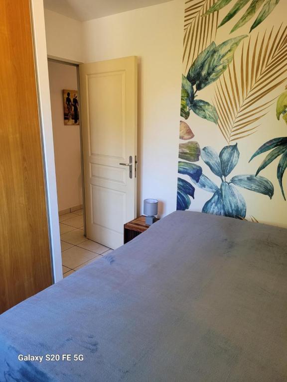 Postel nebo postele na pokoji v ubytování Côte ouest - Appartement F3