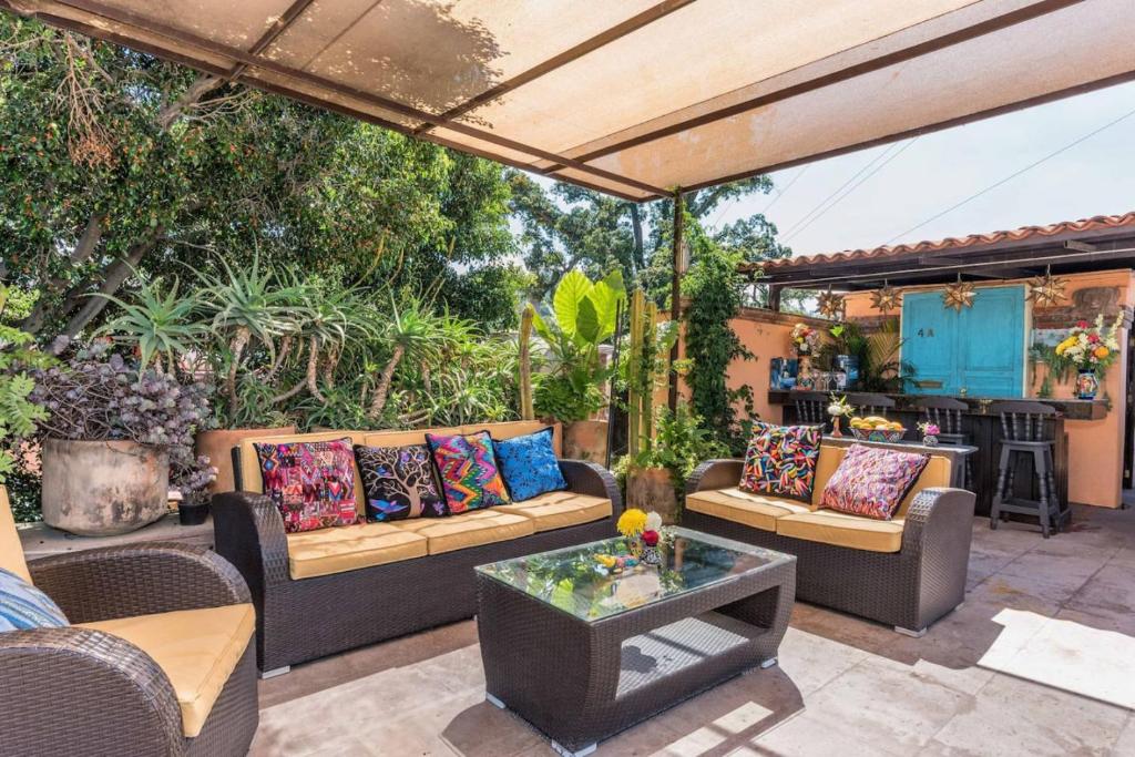 an outdoor patio with couches and a table at La Pajarera prime location in San Miguel in San Miguel de Allende