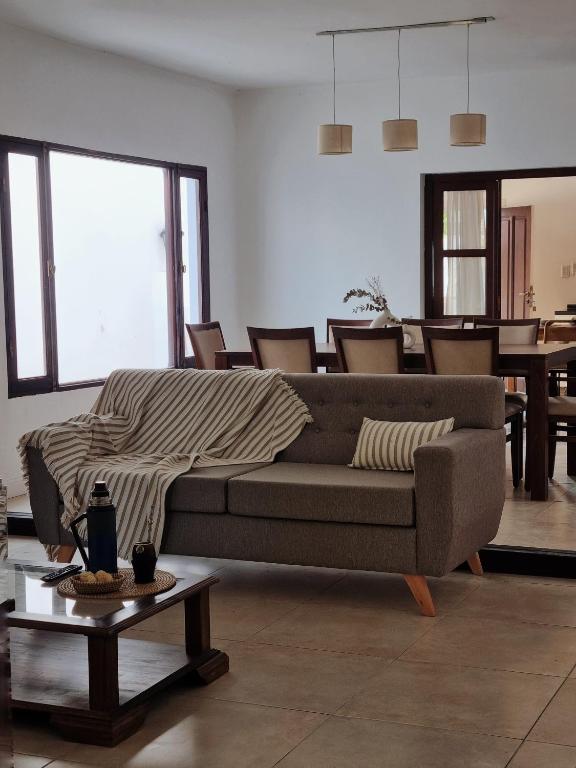 a living room with a couch and a table at Pyaguapy in Esquina
