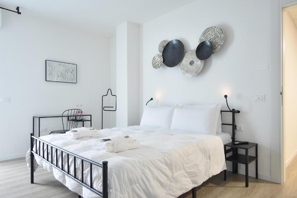 Katil atau katil-katil dalam bilik di Welc-ōM Padova Panta Rei rooms