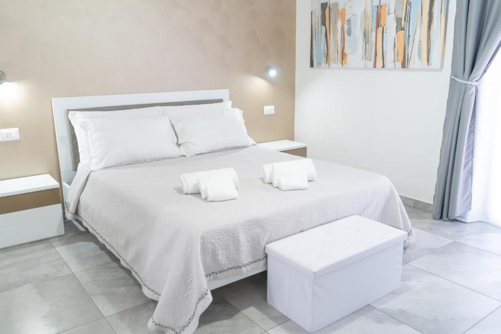 Łóżko lub łóżka w pokoju w obiekcie Four Winds B&B