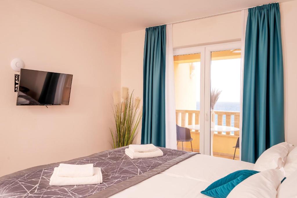 Кровать или кровати в номере Hotel SOL