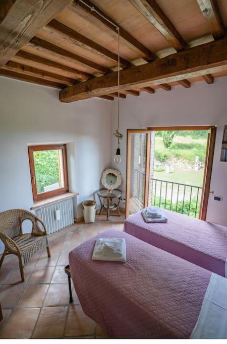 Postel nebo postele na pokoji v ubytování Casale in Val D Orcia