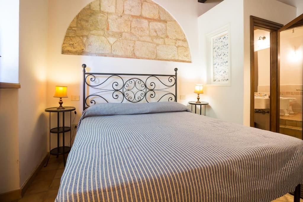 Postel nebo postele na pokoji v ubytování Casale in Val D Orcia