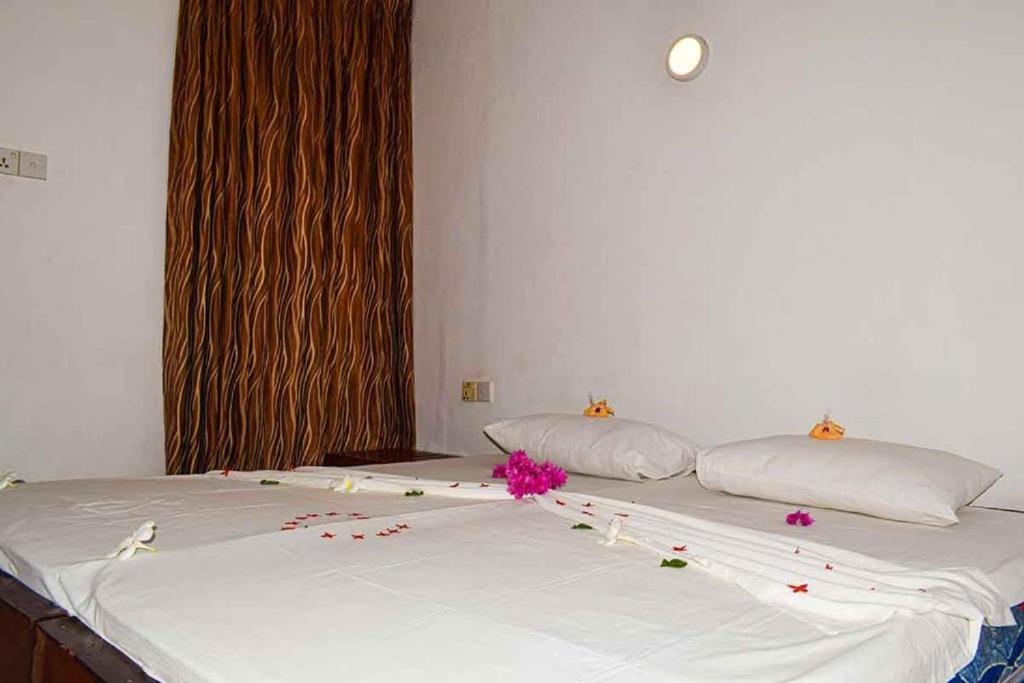 Postel nebo postele na pokoji v ubytování Elephant safari Lodge sigiriya junction