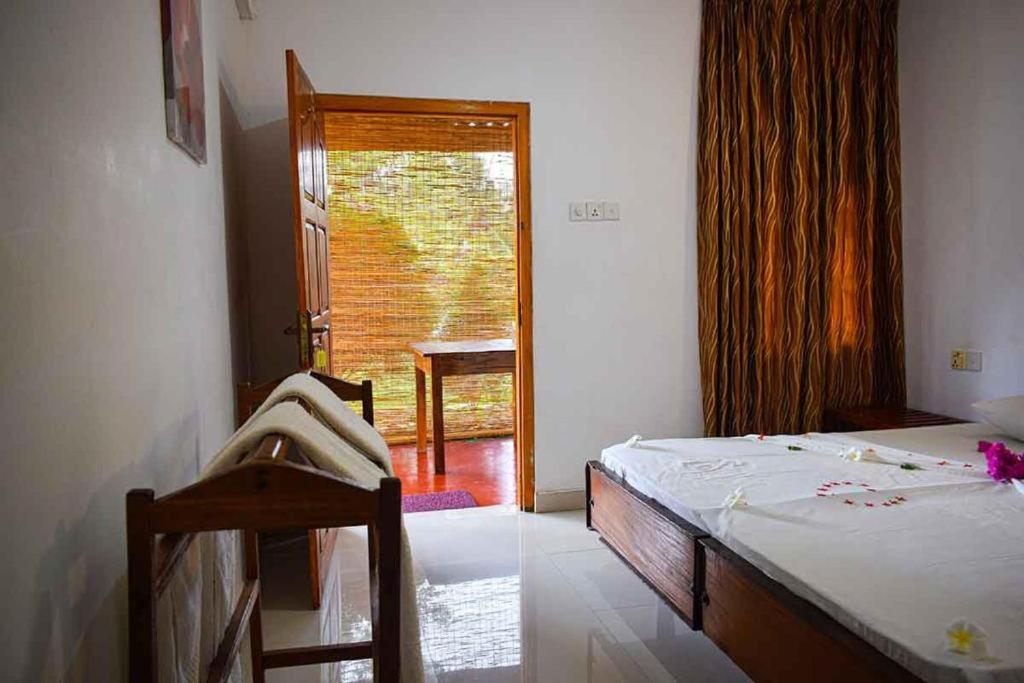 Postel nebo postele na pokoji v ubytování Elephant safari Lodge sigiriya junction