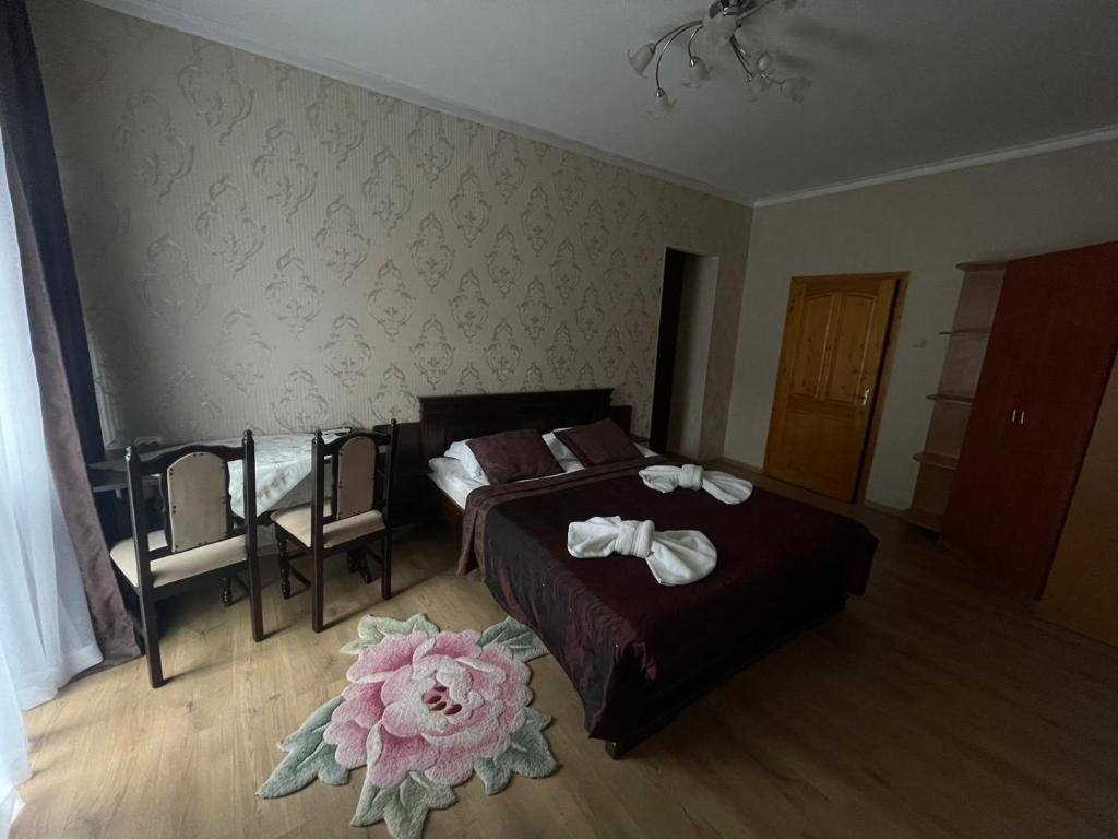 Postel nebo postele na pokoji v ubytování Сонячна Перлина
