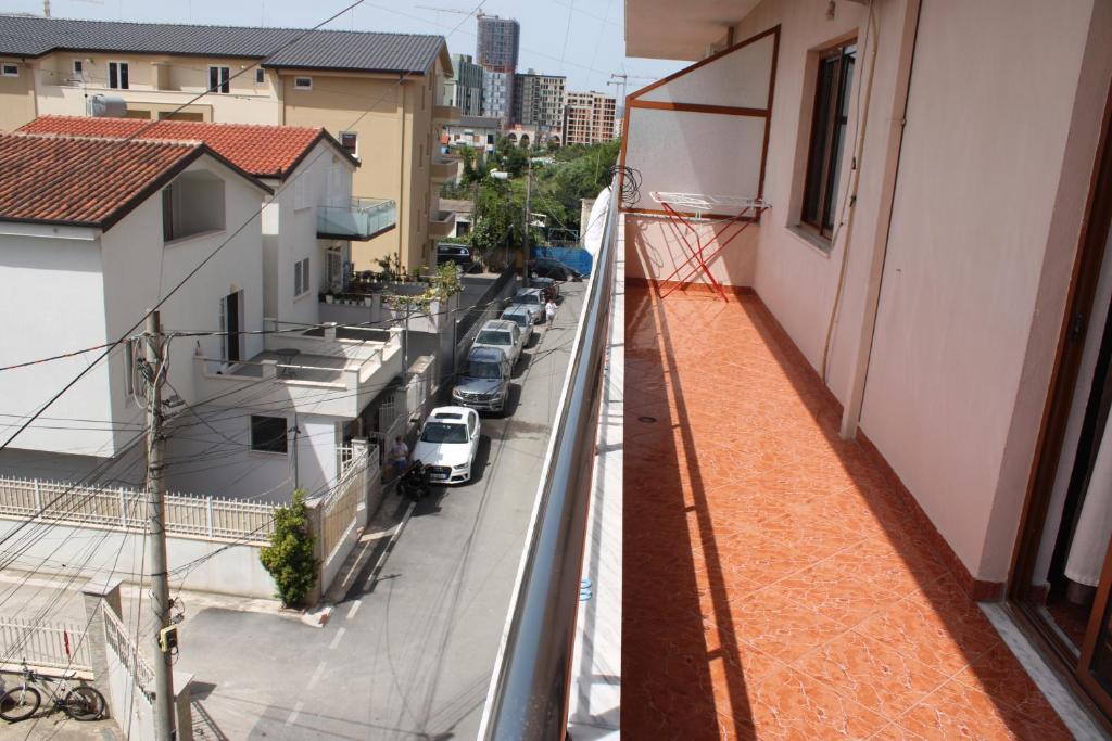 a view of a street from the balcony of a building at Crew Hostel Tirana in Tirana
