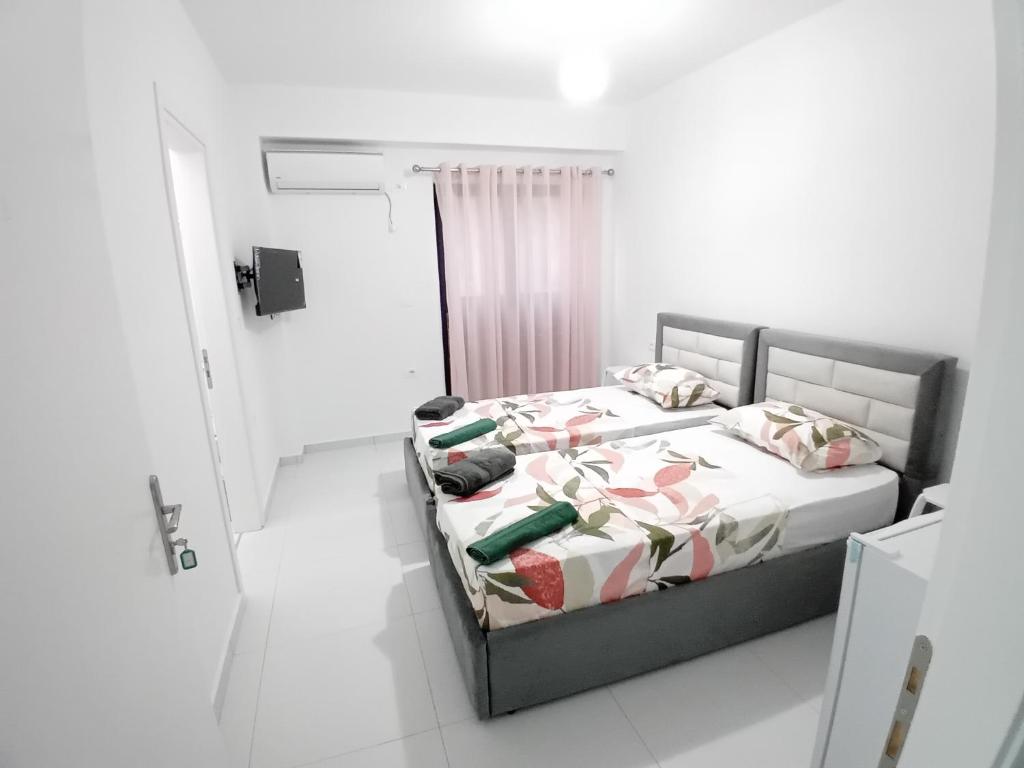 Postel nebo postele na pokoji v ubytování Ida Apartments