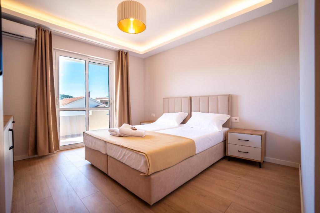 Postel nebo postele na pokoji v ubytování Illyria Hotel