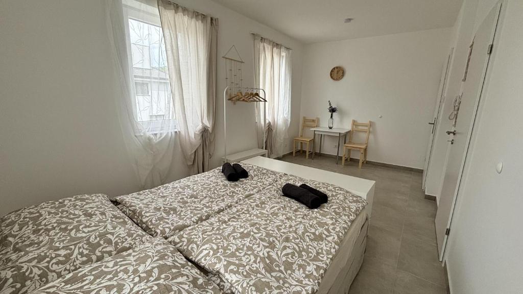Postel nebo postele na pokoji v ubytování Langenzersdorf Apartment