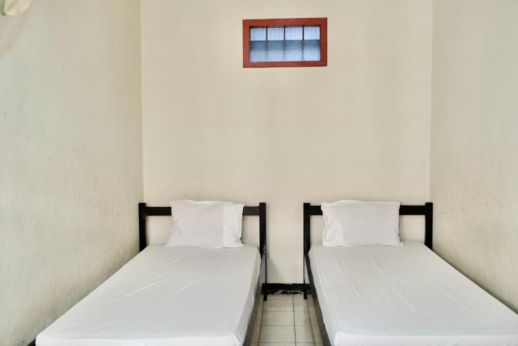 Katil atau katil-katil dalam bilik di Garuda Setia Hotel