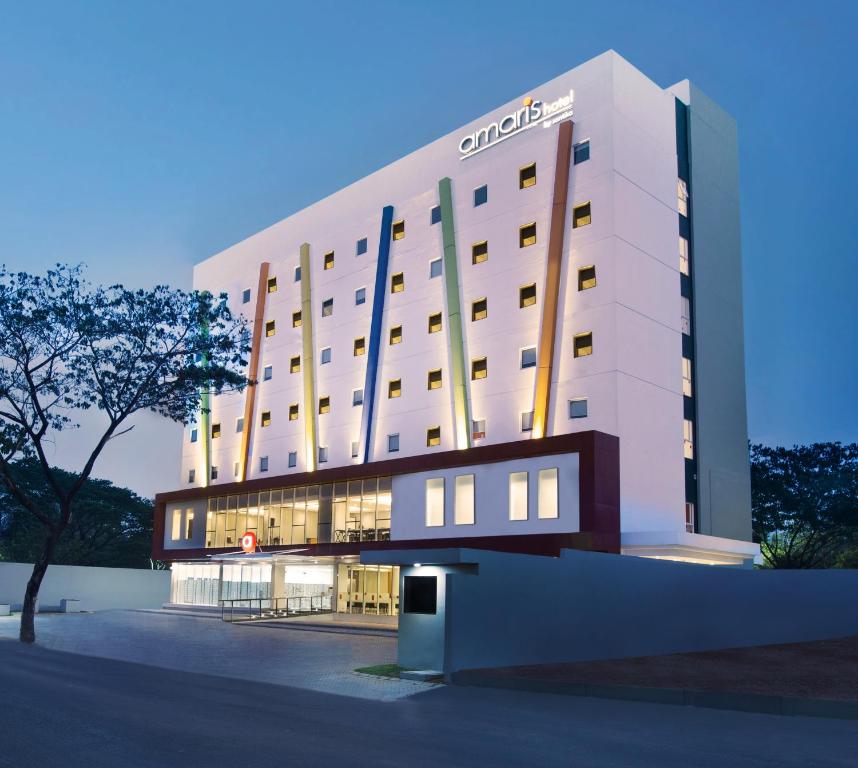 a rendering of a hotel building at dusk at Amaris Hotel Citra Raya – Tangerang in Tangerang