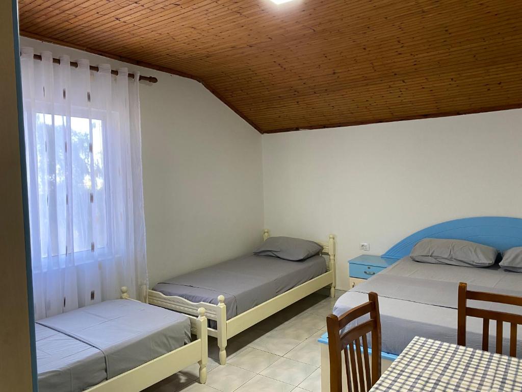 Postel nebo postele na pokoji v ubytování Te Toni Divjake