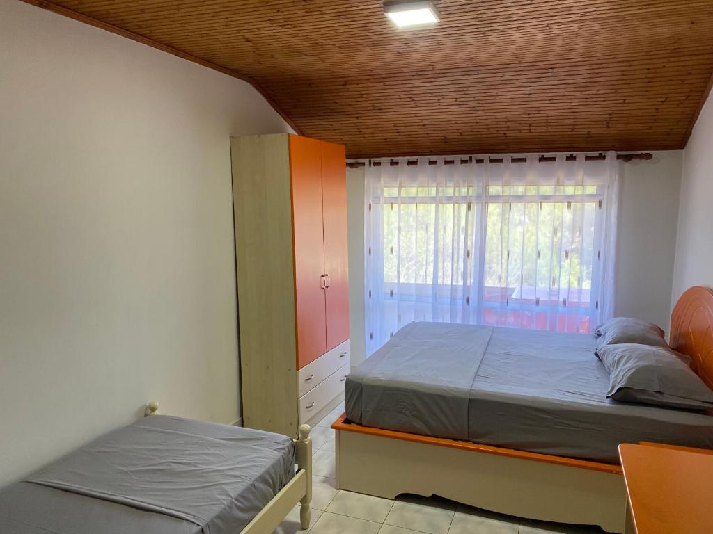 Postel nebo postele na pokoji v ubytování Te Toni Divjake