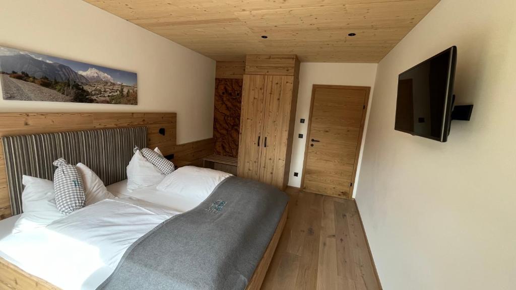 Postel nebo postele na pokoji v ubytování Quartier Severin