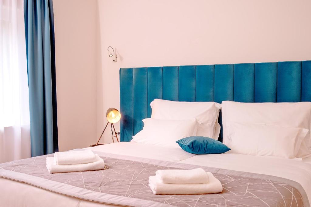 Кровать или кровати в номере Hotel SOL