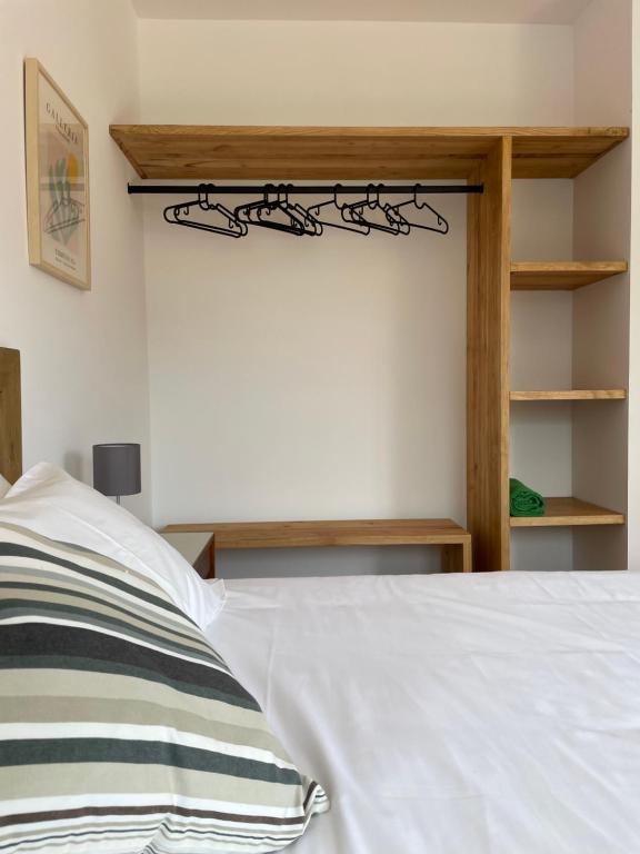 Postel nebo postele na pokoji v ubytování Oliva Home Ericeria