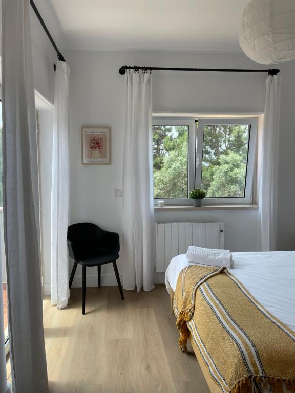 Postel nebo postele na pokoji v ubytování Oliva Home Ericeria