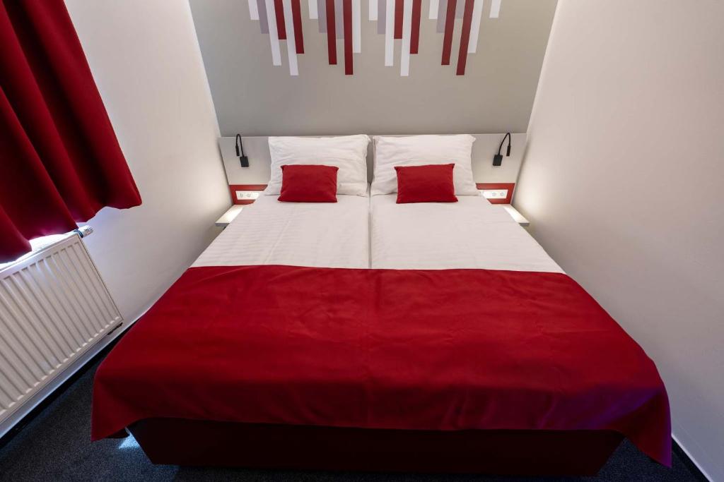 Postel nebo postele na pokoji v ubytování Hotel Villa Eden