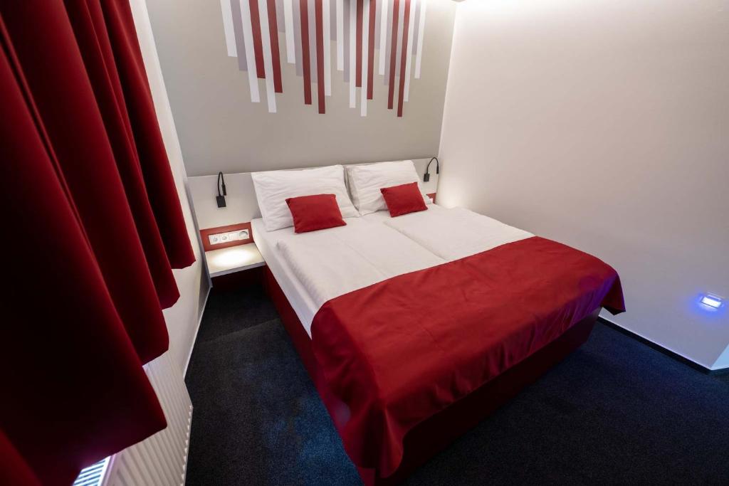 Postel nebo postele na pokoji v ubytování Hotel Villa Eden