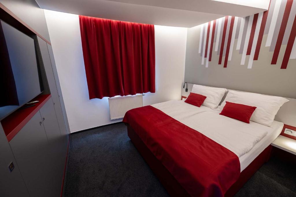 Postel nebo postele na pokoji v ubytování Hotel Villa Eden
