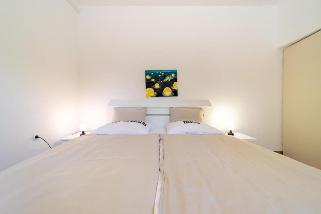 Postel nebo postele na pokoji v ubytování Apartmani Višnja