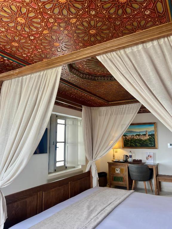 Postel nebo postele na pokoji v ubytování La Menara Hotel & SPA