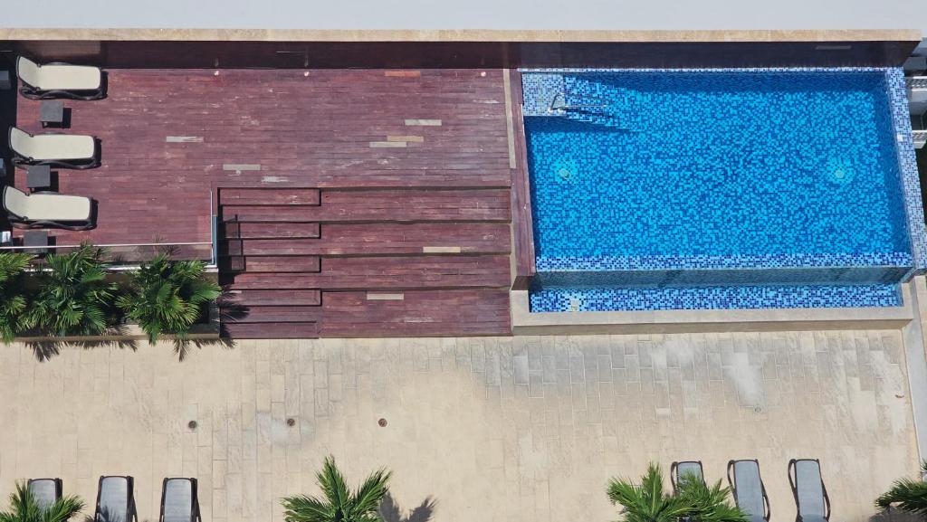 Bazén v ubytování Cómodo Apartamento frente al Mar nebo v jeho okolí