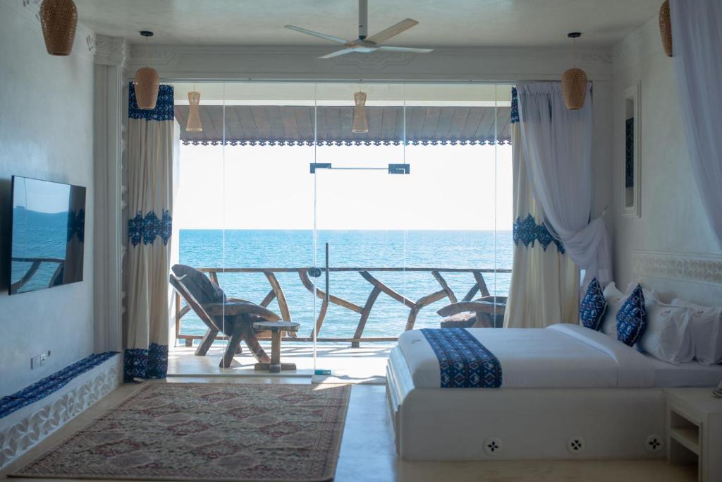 Postel nebo postele na pokoji v ubytování Royal Cliff Zanzibar